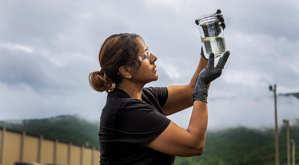 AER environmental consultant Shivvani Regert performing a water inspection