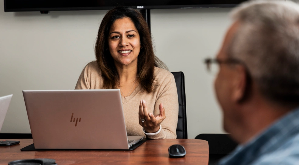 AER team members Shivvani Regert and Travis Lane discussing a waste management project