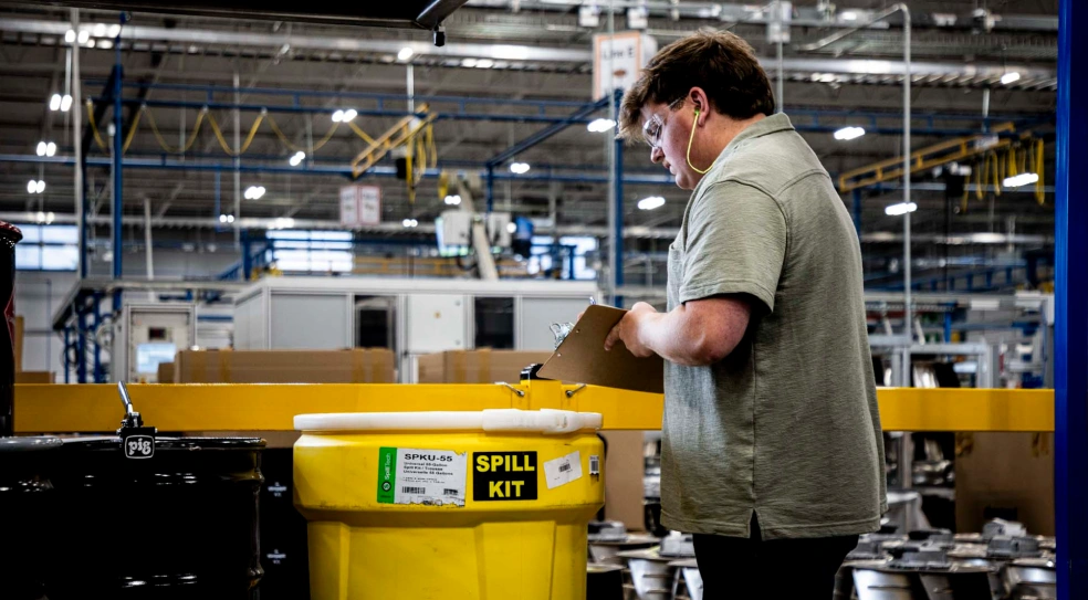 AER team member Raley Hendrix conducting a waste management audit